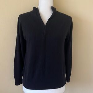 Black zip up 3/4 sleeve sweater.